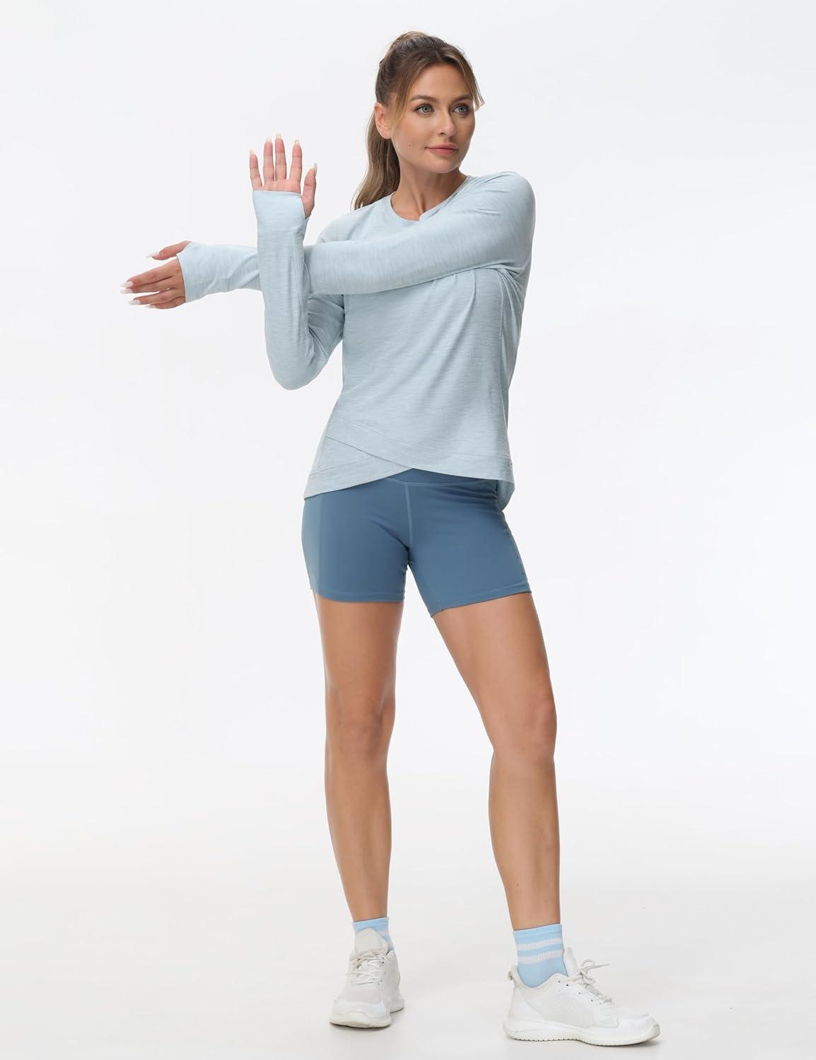 imageWomens Long Sleeve Compression Shirts Workout Tops Cross Hem Athletic Running Yoga TShirts with Thumb HoleLight Blue Heather