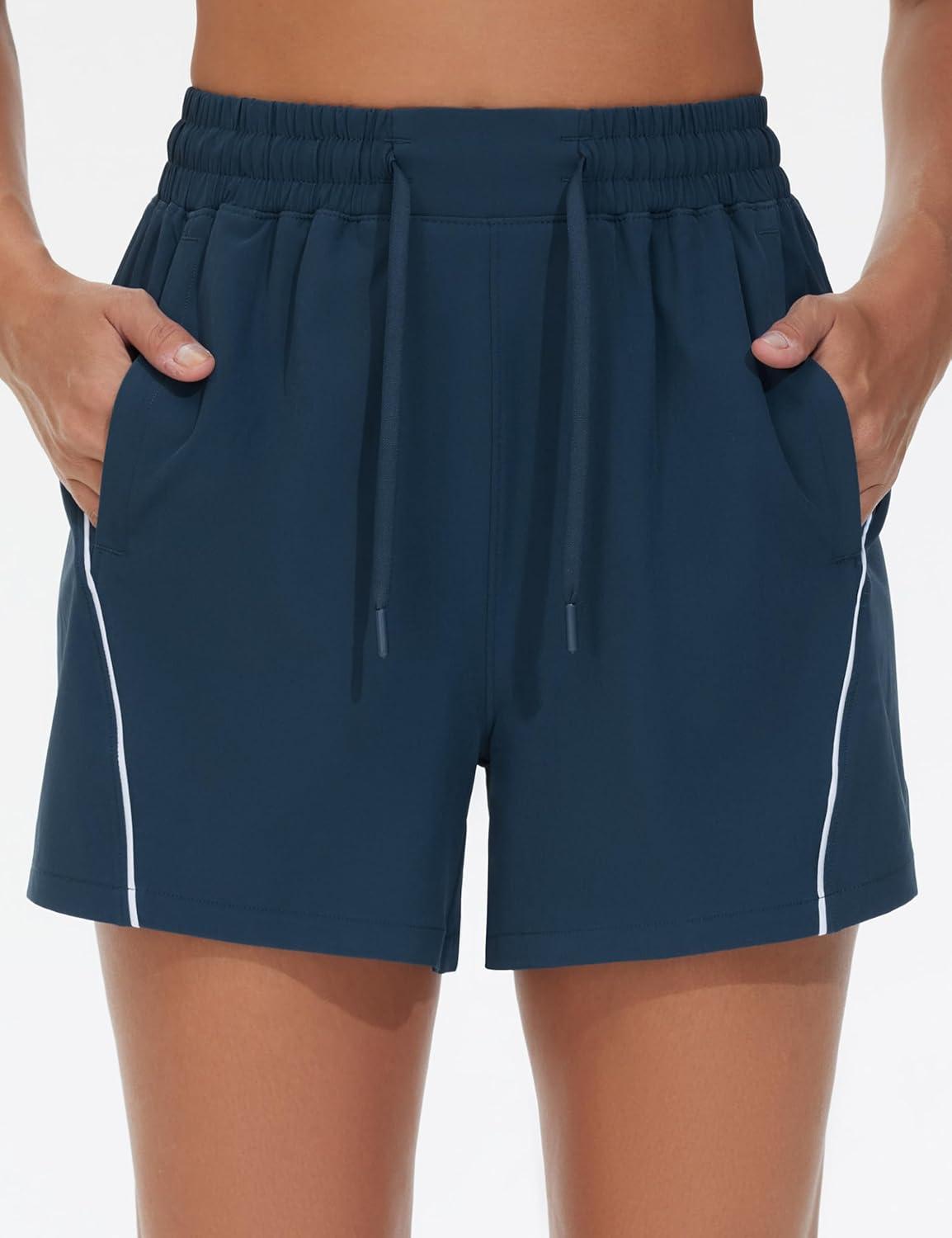 imageTHE GYM PEOPLE Womens High Waist Running Shorts with Pockets Loose Fit Lightweight Workout Yoga Athletic TracksBlue