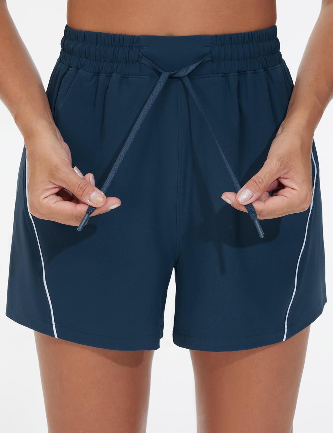 imageTHE GYM PEOPLE Womens High Waist Running Shorts with Pockets Loose Fit Lightweight Workout Yoga Athletic TracksBlue