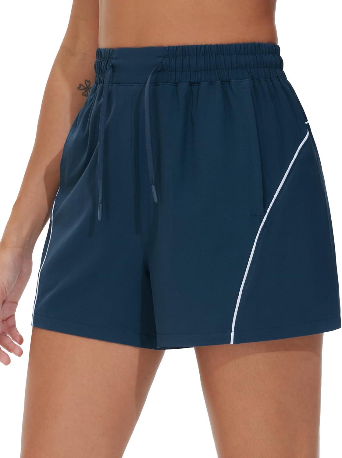 imageTHE GYM PEOPLE Womens High Waist Running Shorts with Pockets Loose Fit Lightweight Workout Yoga Athletic TracksBlue