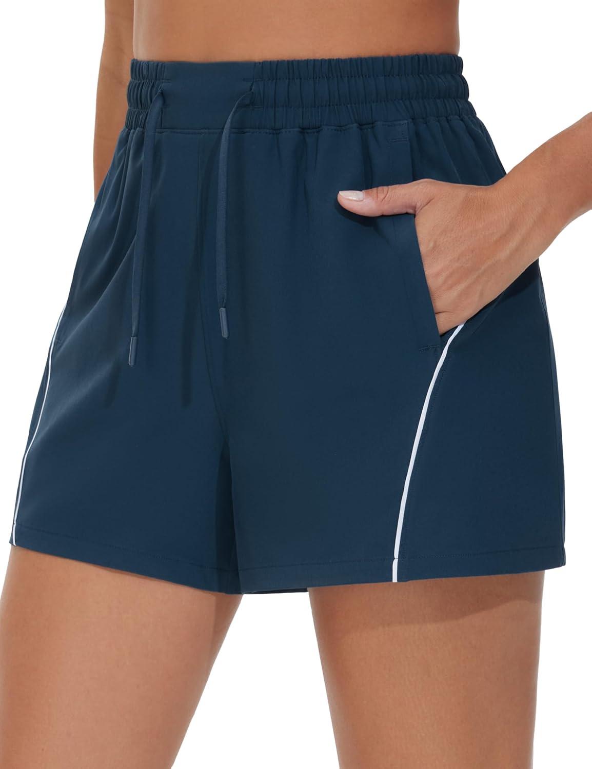 imageTHE GYM PEOPLE Womens High Waist Running Shorts with Pockets Loose Fit Lightweight Workout Yoga Athletic TracksBlue